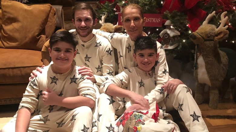 Céline Dion, René-Charles, Eddy, and Nelson Angélil smiling