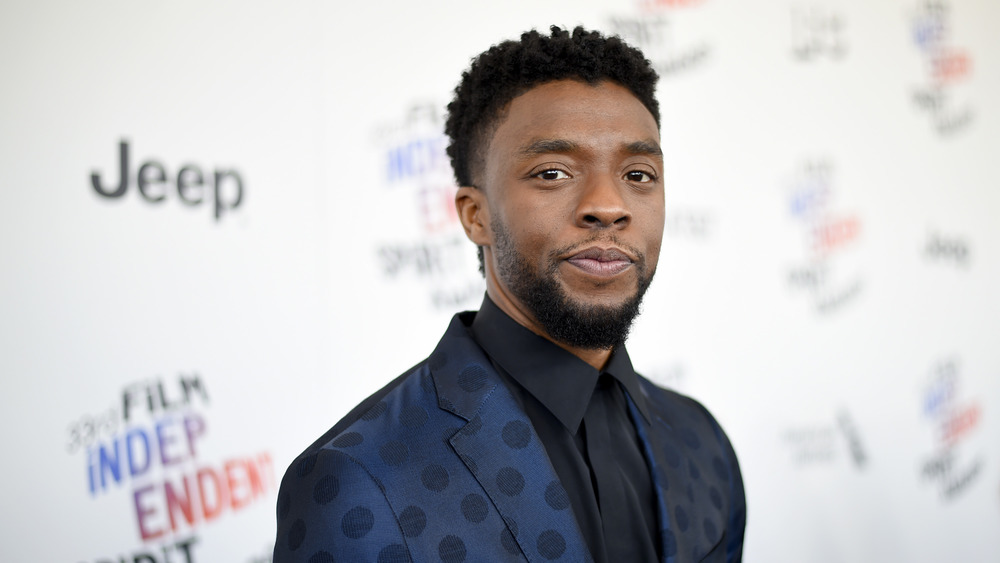 Chadwick Boseman posing at an event