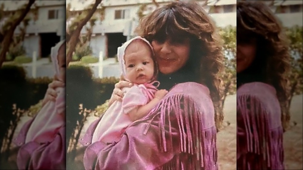 Chanel West Coast as a baby in her mother's arms