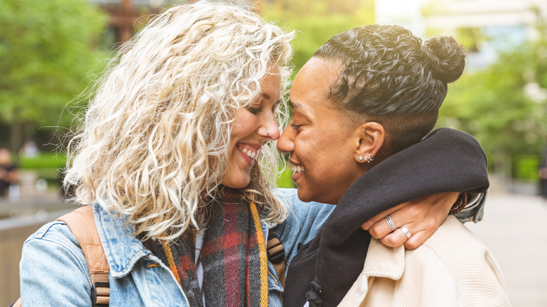 women smiling at each other