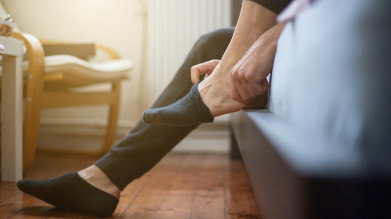 Person putting on socks