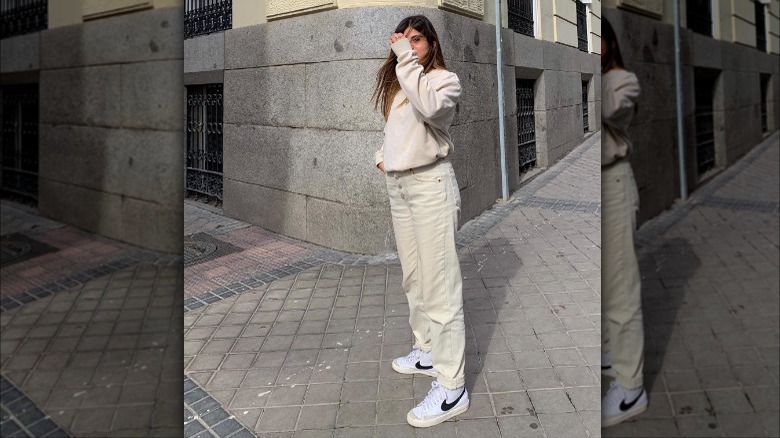 woman standing in all-white