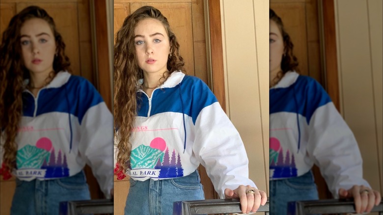 Chappell Roan posing with her naturally brown, curly hair