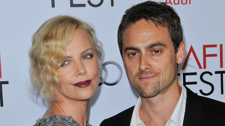 Theron poses with her ex Stuart Townsend on the red carpet