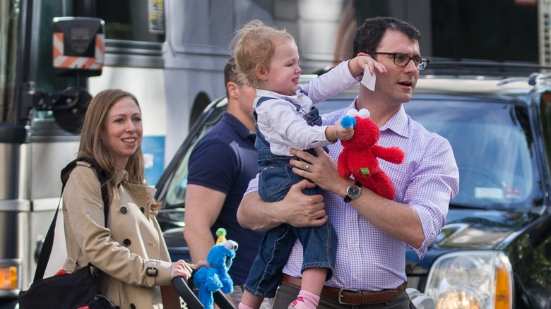 Marc Mezvinsky and Chelsea Clinton out and about with their children