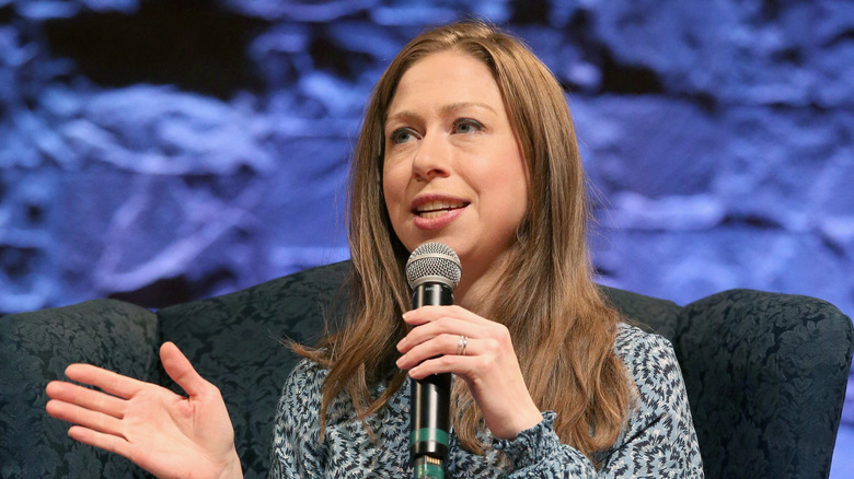 Chelsea Clinton speaking into microphone