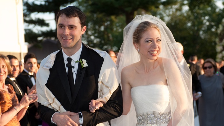 Marc Mezvinsky and Chelsea Clinton smiling at wedding