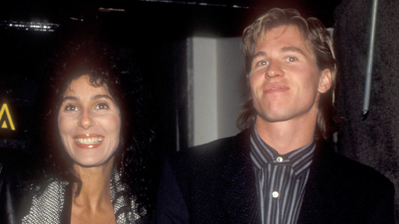 Cher and Val Kilmer smiling in their younger days