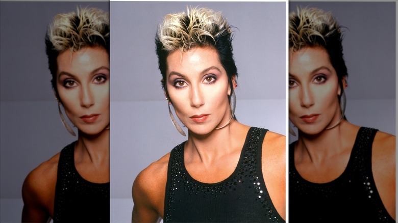 Cher posing with pixie cut and blond tips