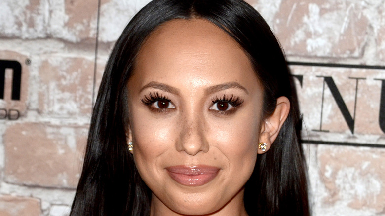 Cheryl Burke poses on the red carpet