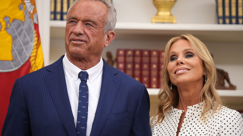 Cheryl Hines standing next to her husband RFK Jr. in the Oval Office