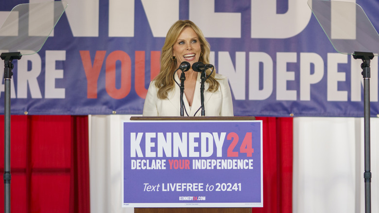 Cheryl Hines smiling at podium