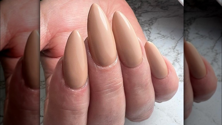 Light brown nails with stiletto tip