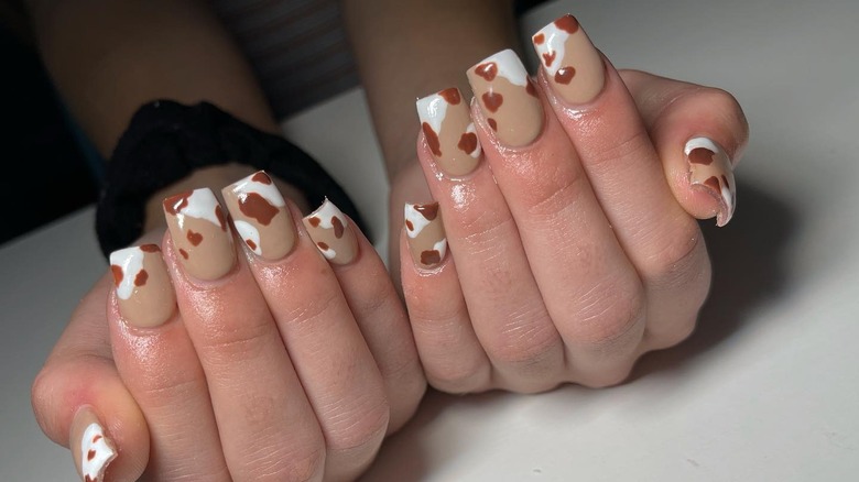 Nude nails with brown and white spots