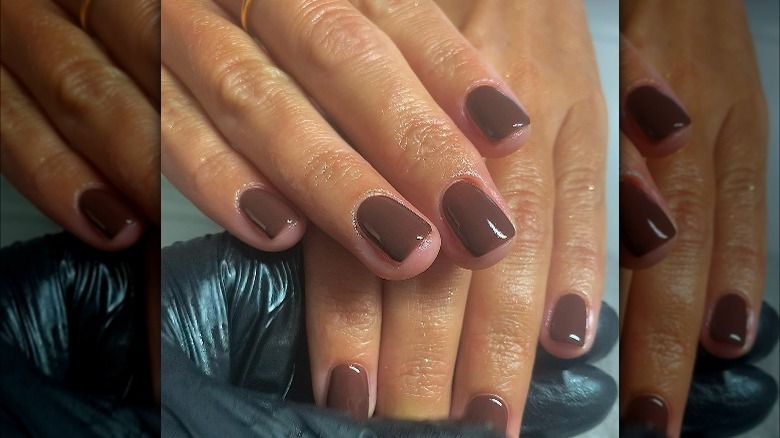 Nails with deep chocolate polish