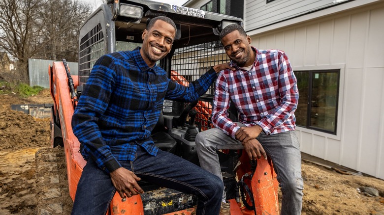 Chris and Calvin LaMont posing with construction equipment