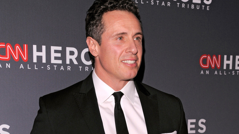 Chris Cuomo looking away from camera smiling