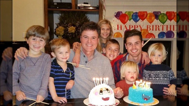 Chris and Donny Osmond with kids