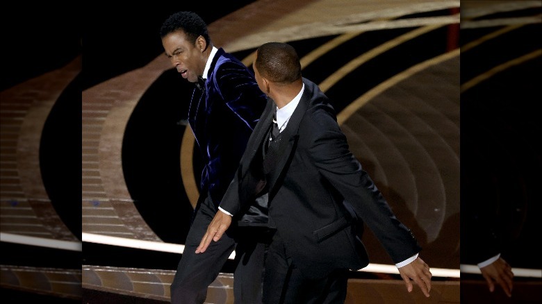 Will Smith smacks Chris Rock in the face on stage at the Academy Awards