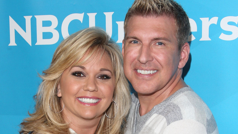 Todd and Julie Chrisley snuggle up on the red carpet