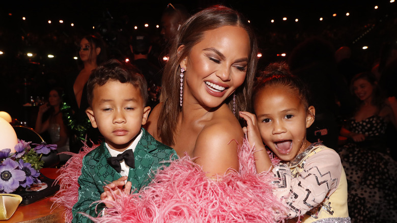 Chrissy Teigen smiling with children Miles and Luna