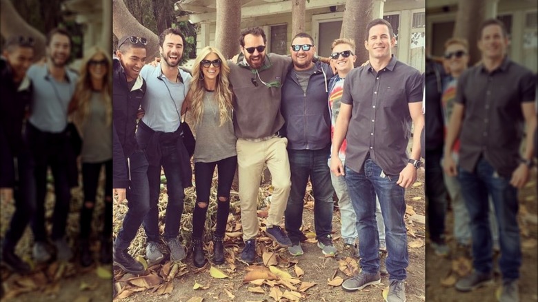 Christina Haack and others from Flip or Flop standing together in front of a house