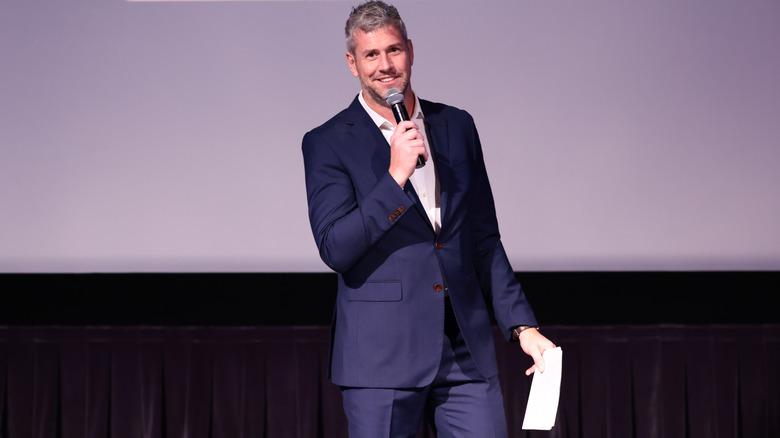 Ant Anstead smiling with microphone