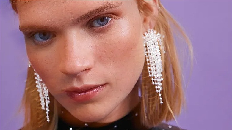 H&M model wears chandelier earrings 