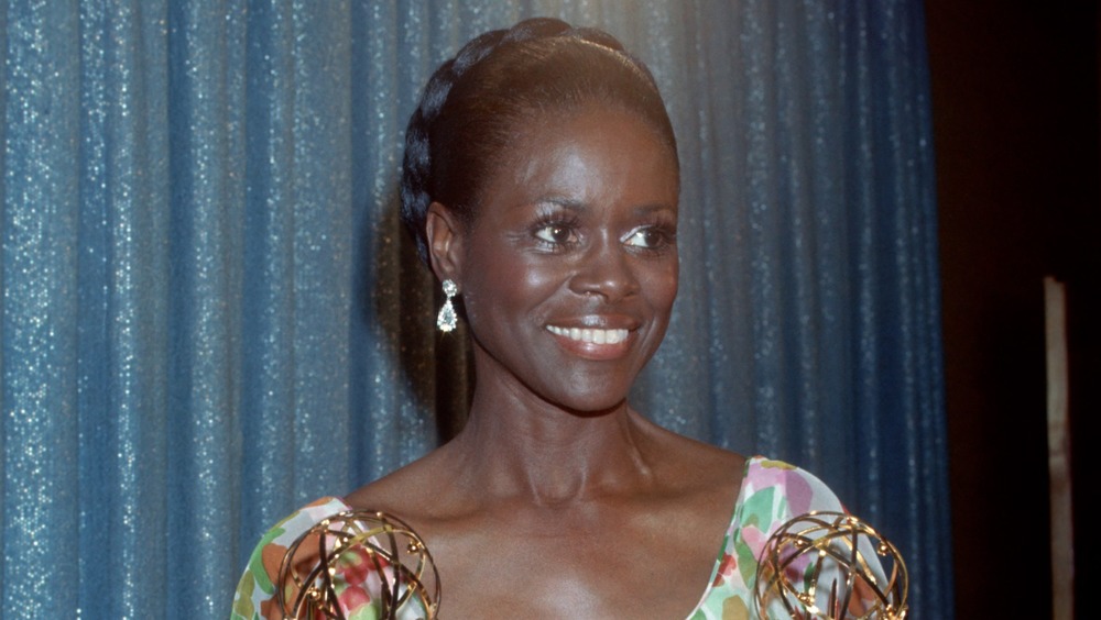 Cicely Tyson smiling, holding her Emmy awards