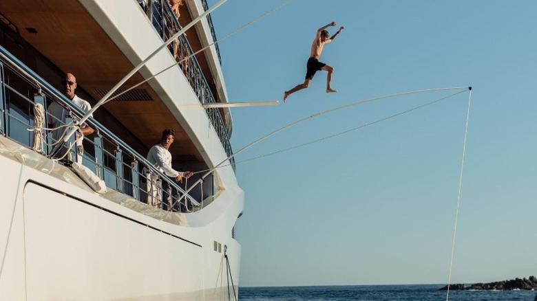 Presley Gerber jumping off a boat