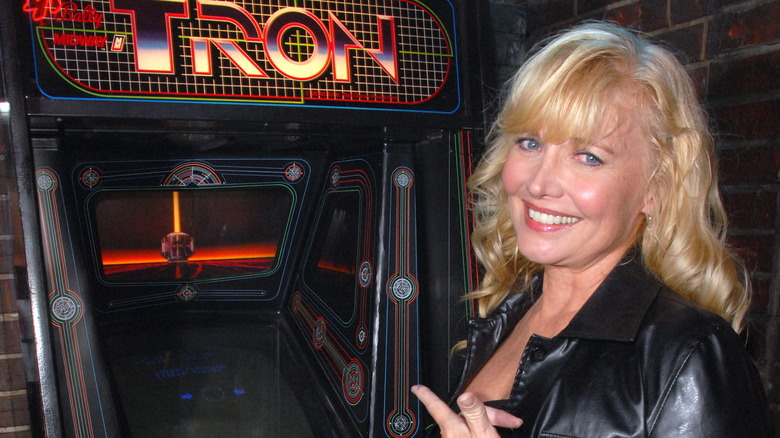 Cindy Morgan with Tron arcade game