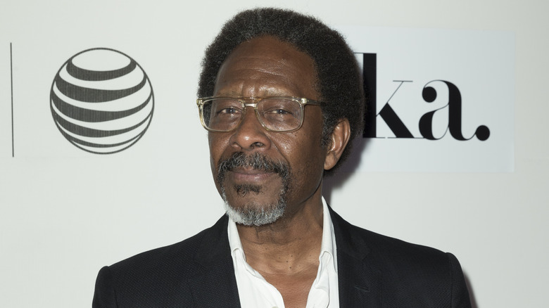 Clarke Peters on red carpet wearing glasses