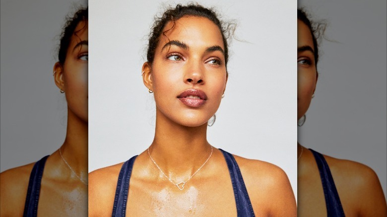 Woman wearing necklace during workout