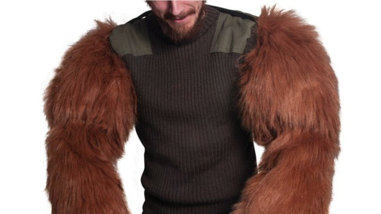 man wearing bear arms costume