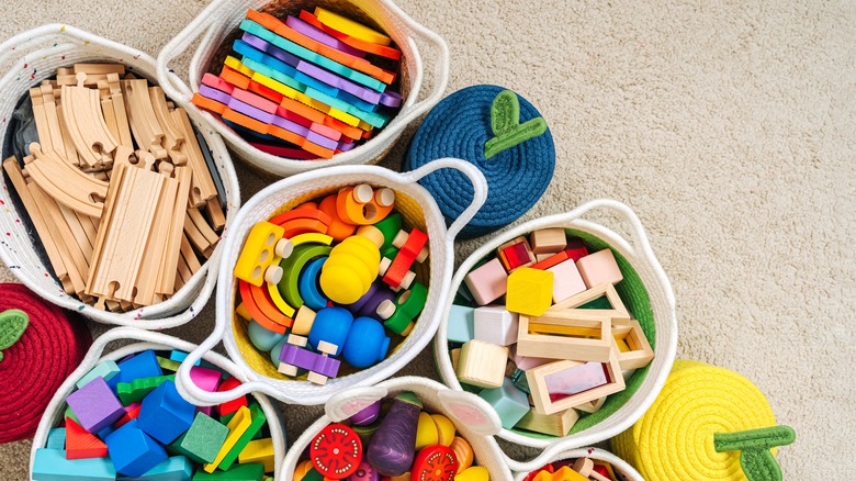 children's toys sorted into baskets 