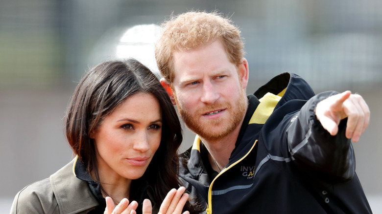 Prince Harry and Meghan Markle during a public outing. 