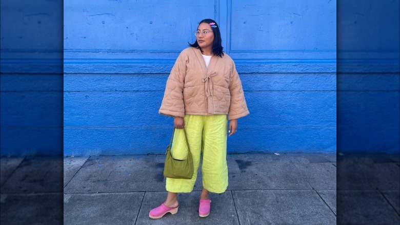 Bright linen pants worn with pink clogs