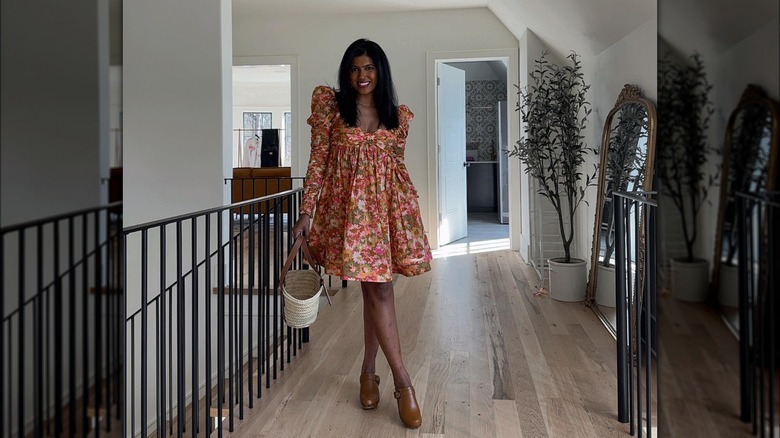 Floral dress paired with brown clogs