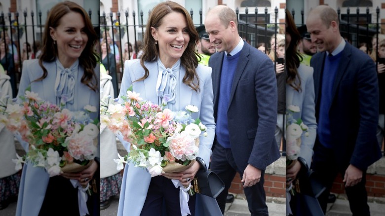 Kate Middleton smiling holding flowers