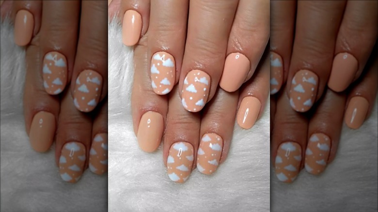 peach background cloud nails 