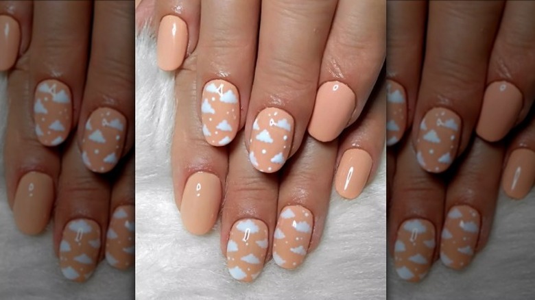 peach background cloud nails