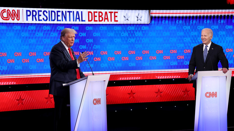 Donald Trump and Joe Biden debating at CNN podiums