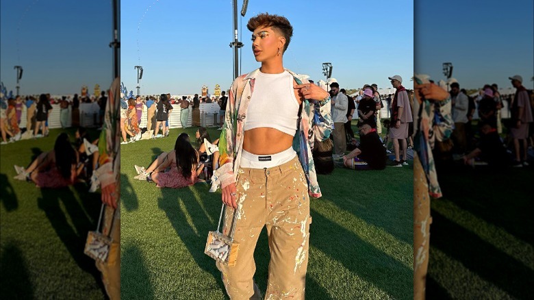 James Charles posing on lawn at Coachella