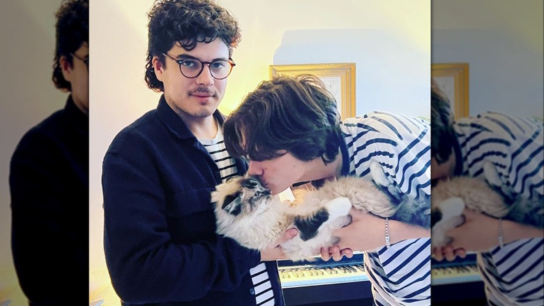 Luca and Matteo Firth posing with a cat