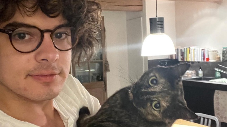 Luca Firth posing with a cat