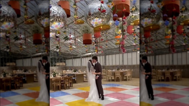 Couple dancing at vibrant wedding venue