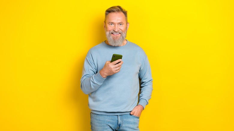 smiling man on yellow background
