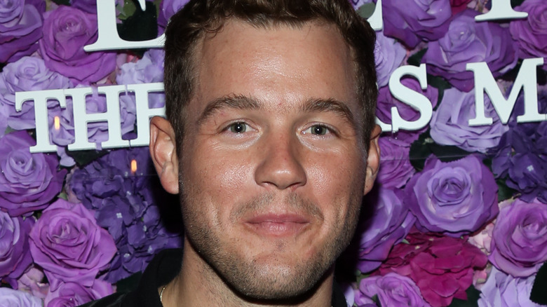 Colton Underwood poses at an event