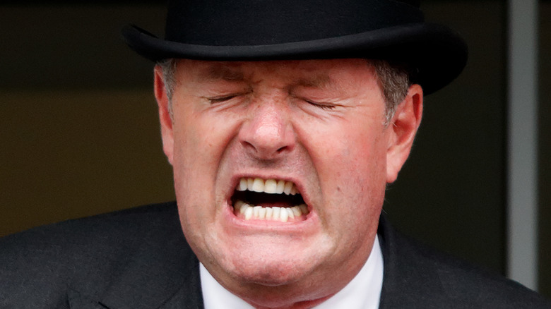 Piers Morgan making a very angry face in a hat