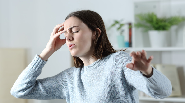 Woman experiencing vertigo